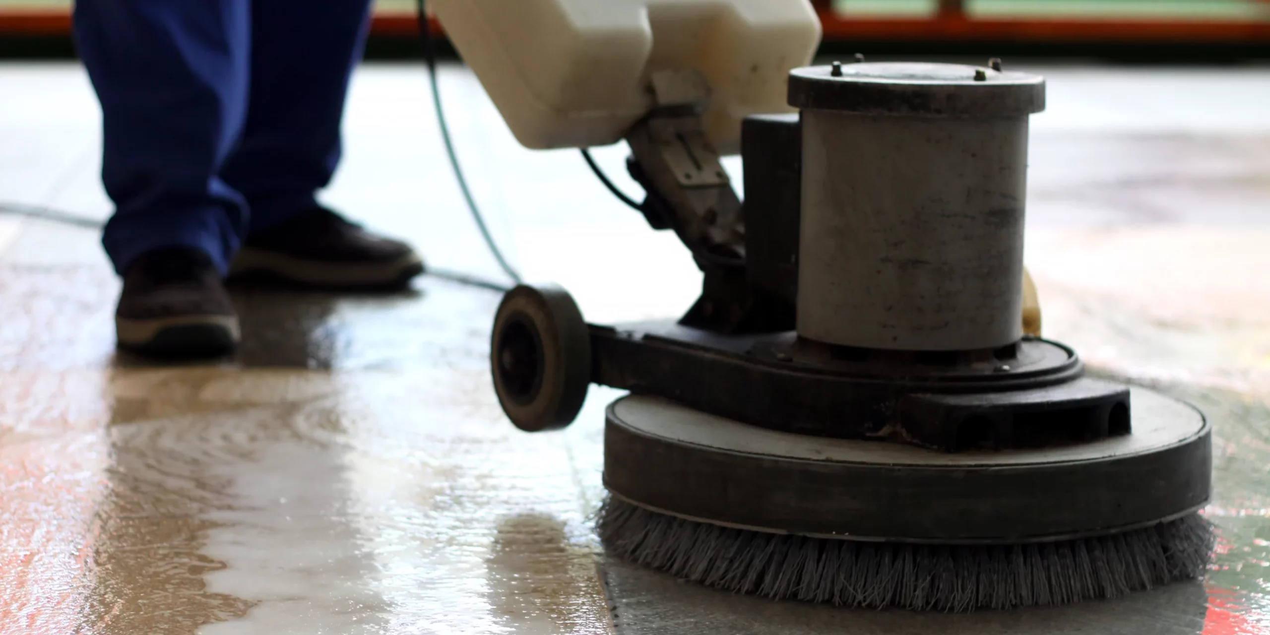 Cleaning machine washing the floor in a shopping